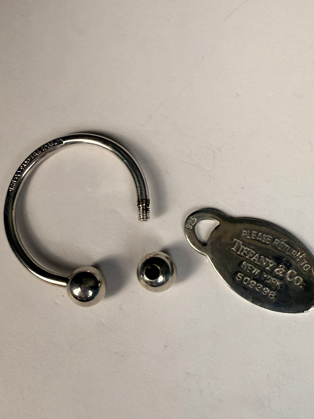 Tiffany & Co. Sterling Silver Oval Tag Key Ring Keychain | 925 Silver | 28.8g - Coyle Fine Jewelry & Timepieces
